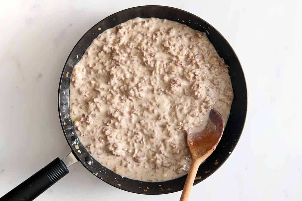 Creamy ground beef mixture in skillet.