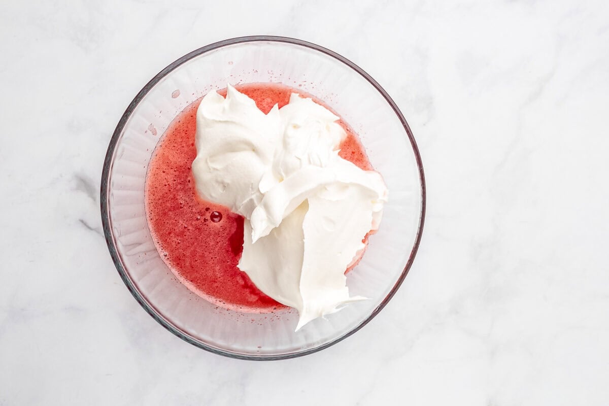 Jello and cool whip in bowl.