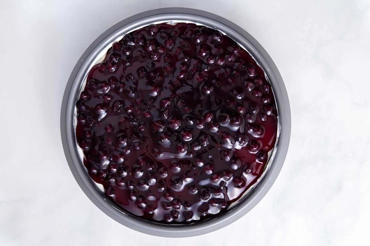 Blueberry no bake cheesecake in pan.