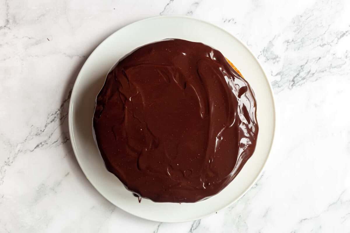 Boston cream cake on cake plate.