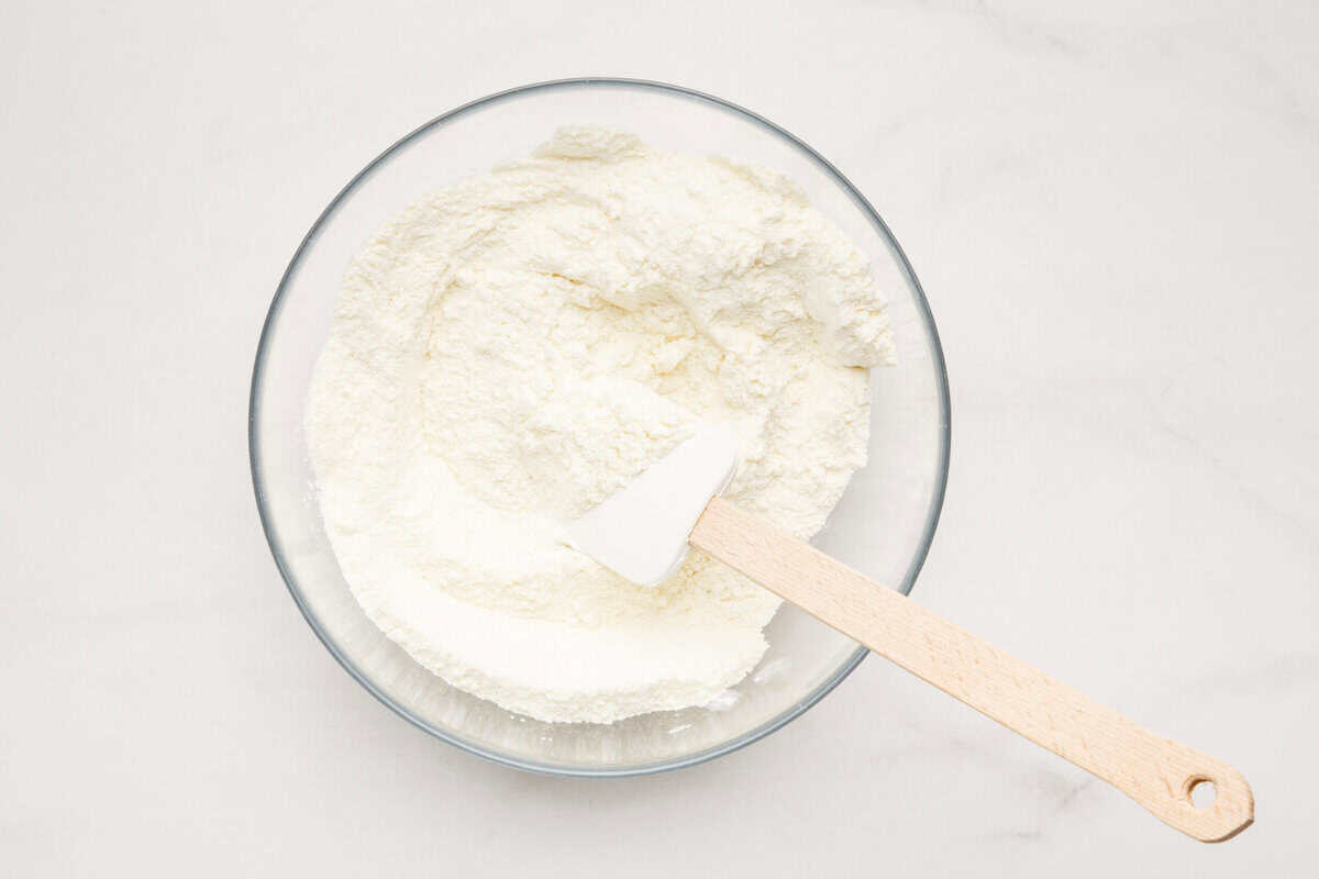 Dry ingredients being mixed in bowl.