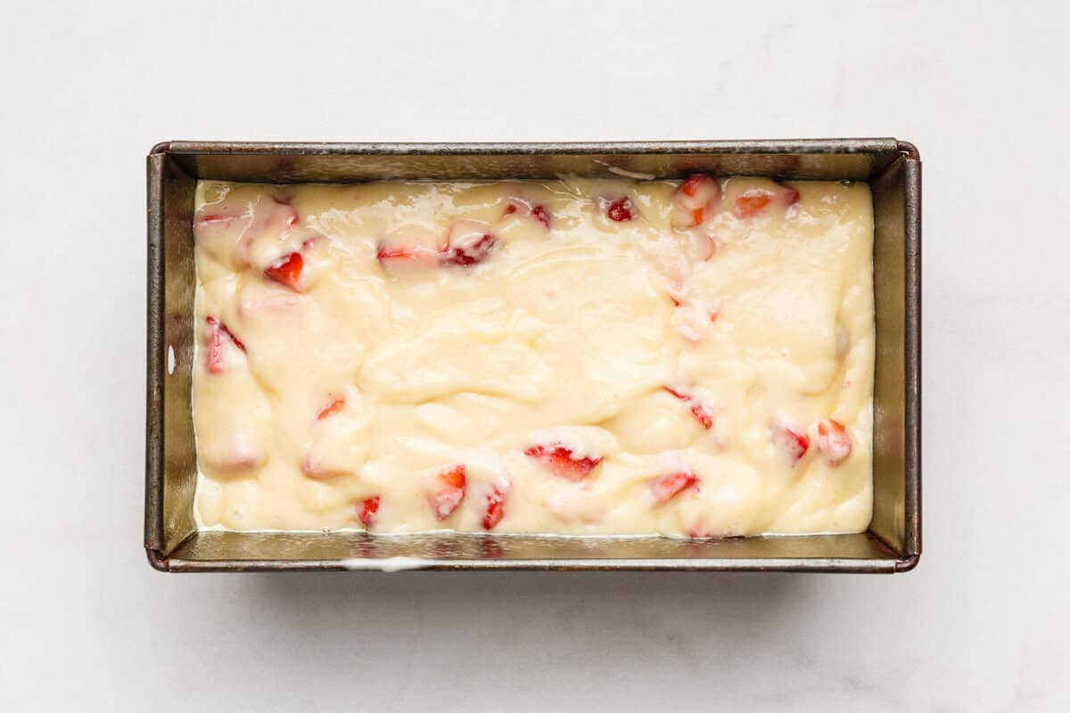 Strawberry bread batter in loaf pan.