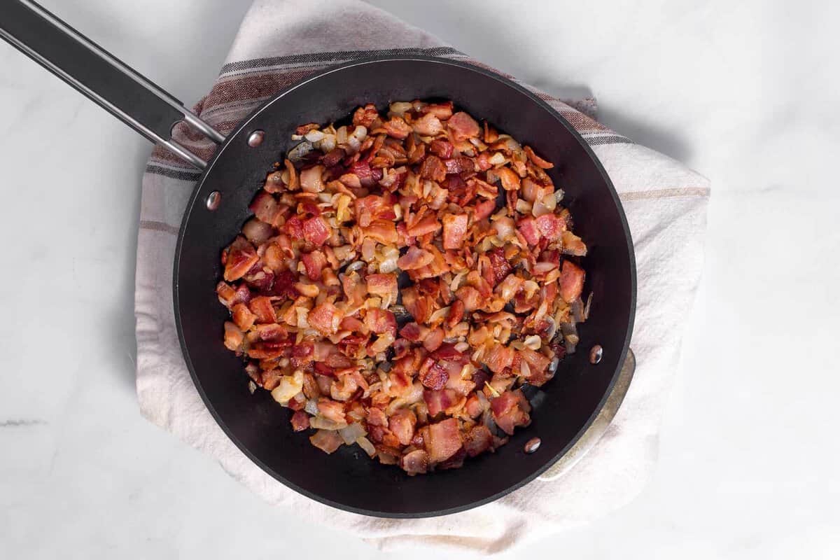 Cooked bacon in skillet.