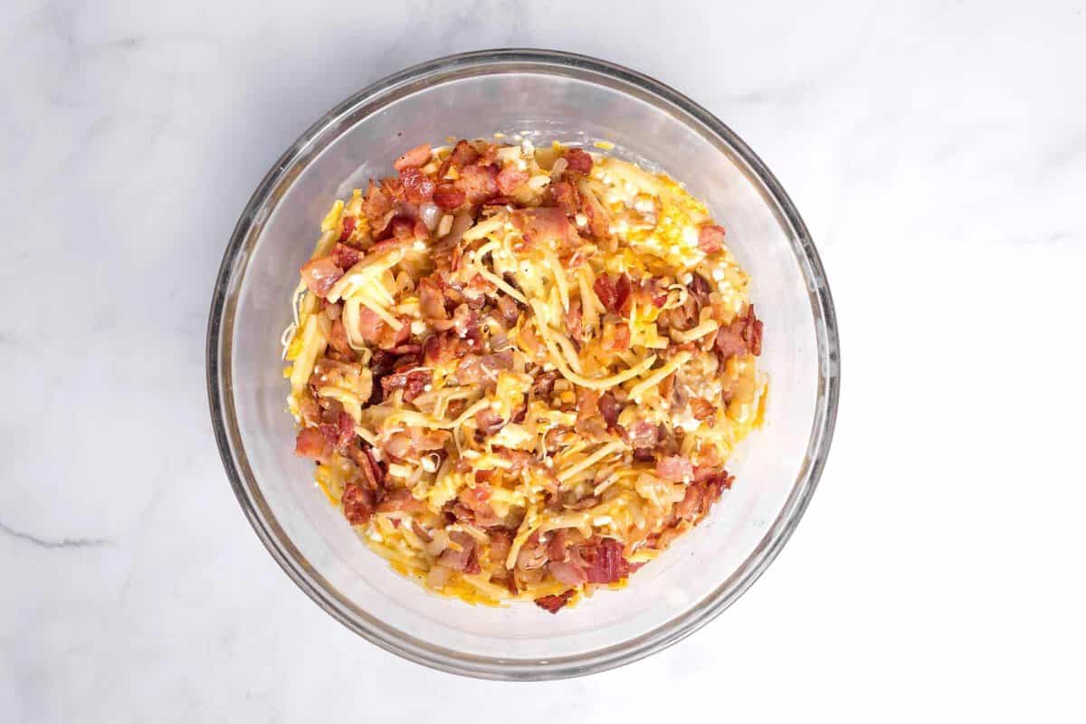 Amish breakfast casserole mixture in bowl.