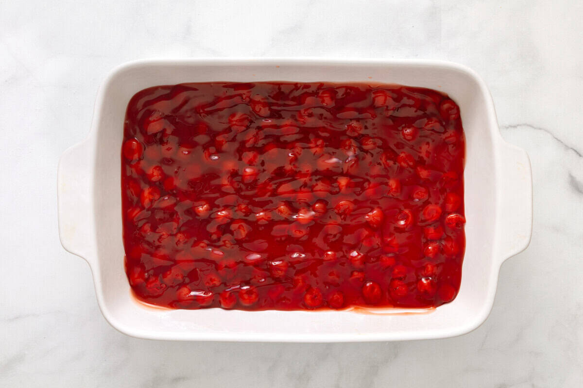 Cherry pie filling in baking dish.