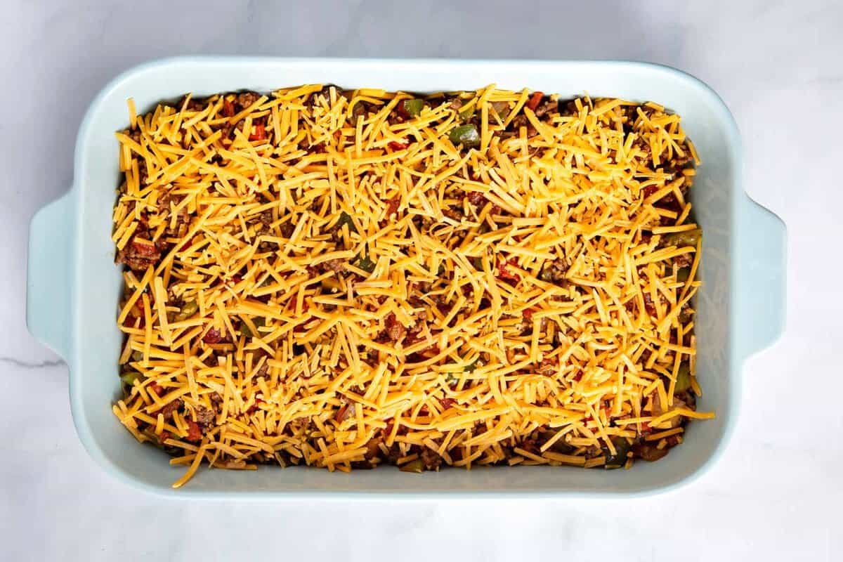 Shredded cheese added to taco bake.