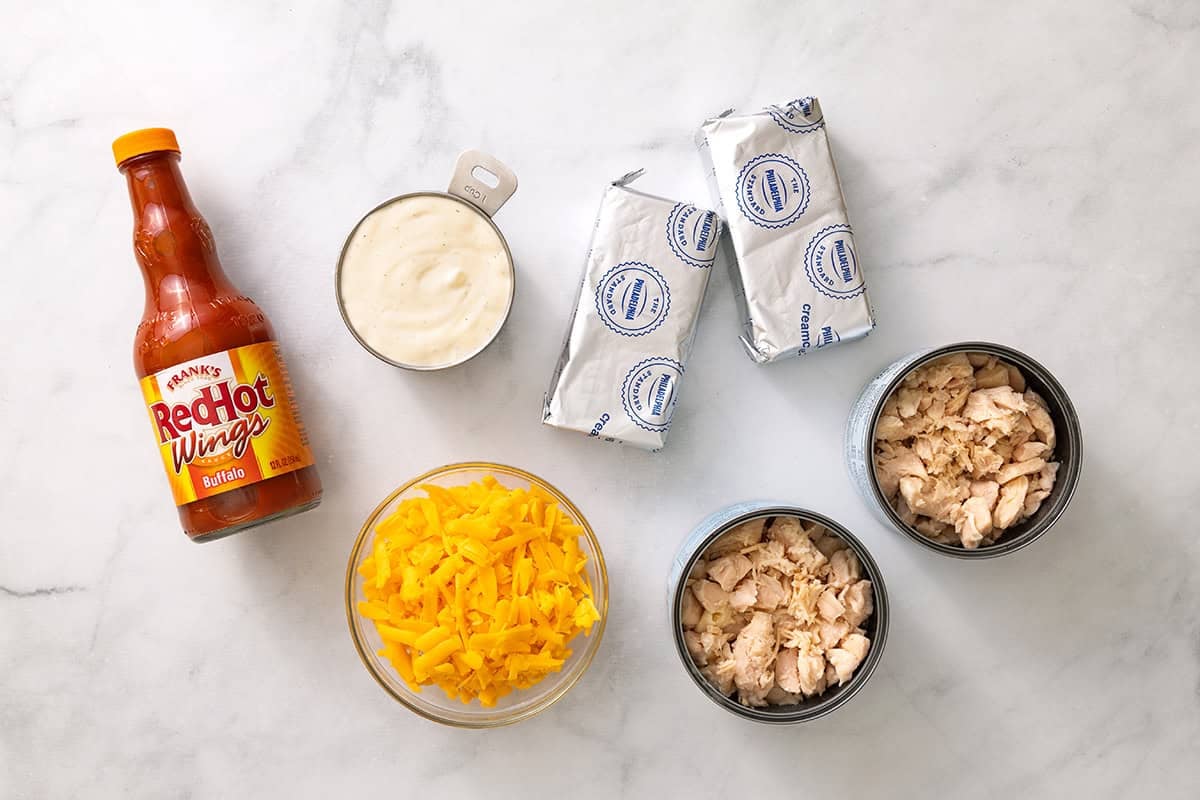 Canned chicken, cream cheese, ranch, Frank's RedHot Buffalo Wings Sauce and shredded cheddar.