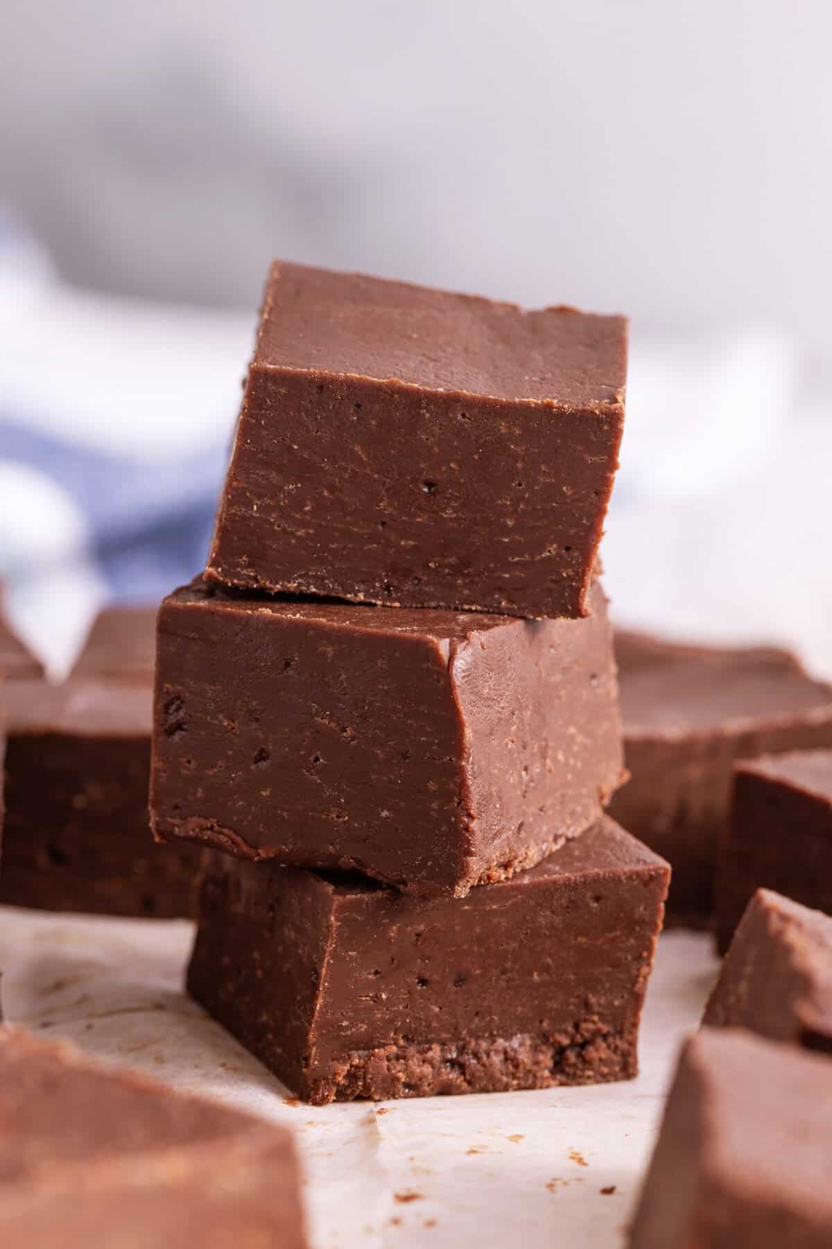 Stack of 3 cubes of homemade fudge.