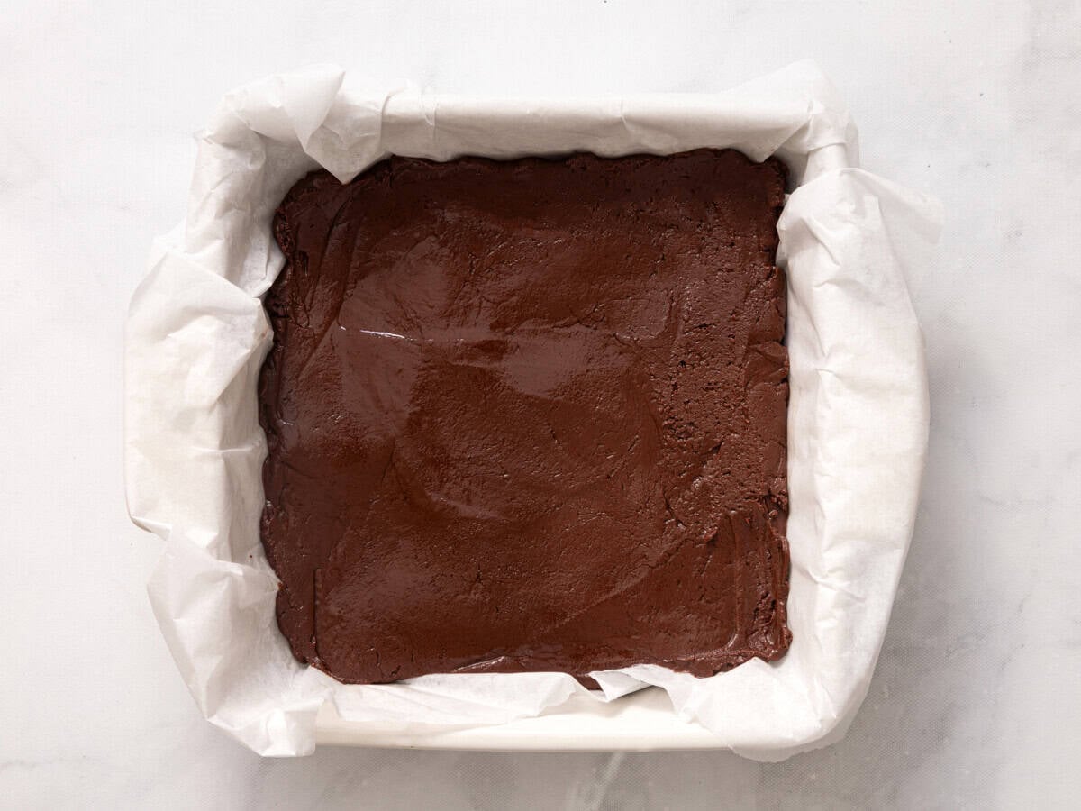 Fudge spread into parchment-lined pan.